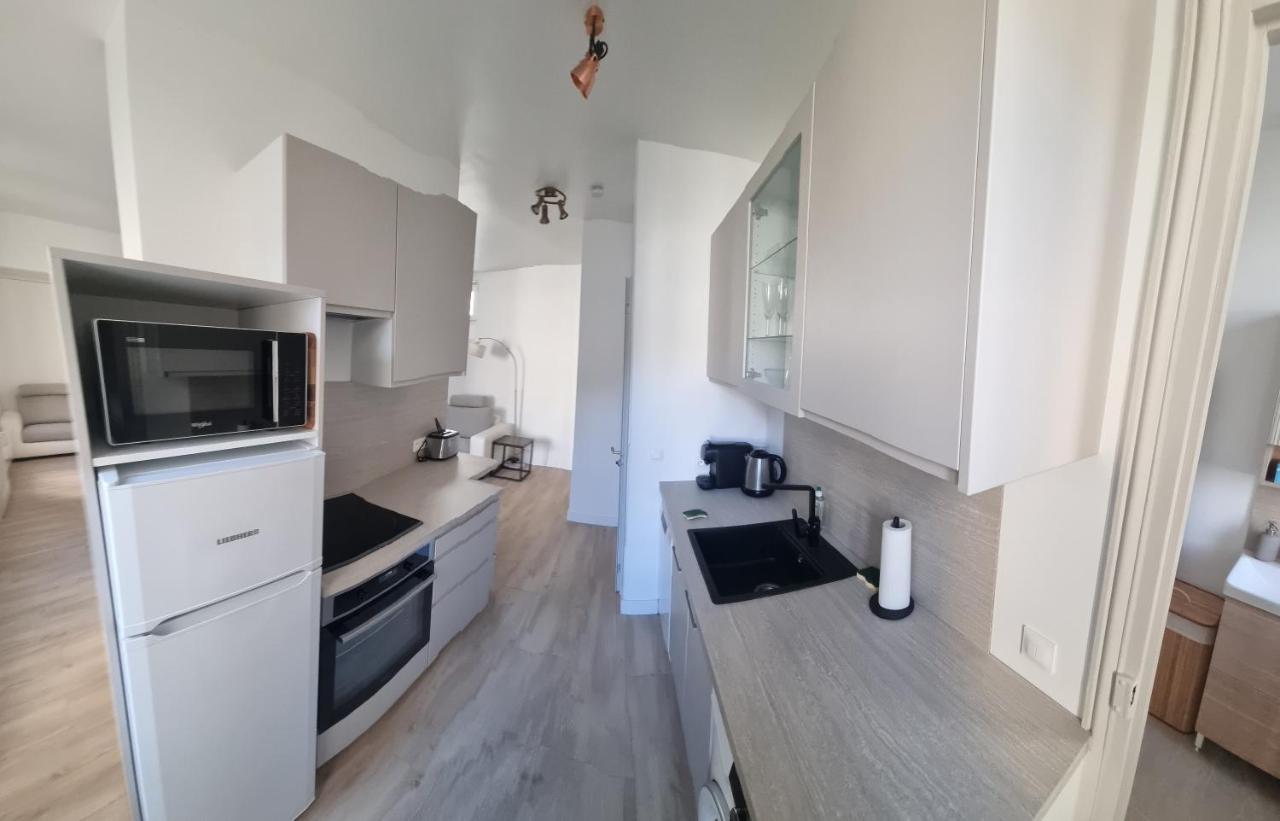 Appartement Luxueux Dans Maison Bourgeoise Parisienne 르발루아페레 외부 사진